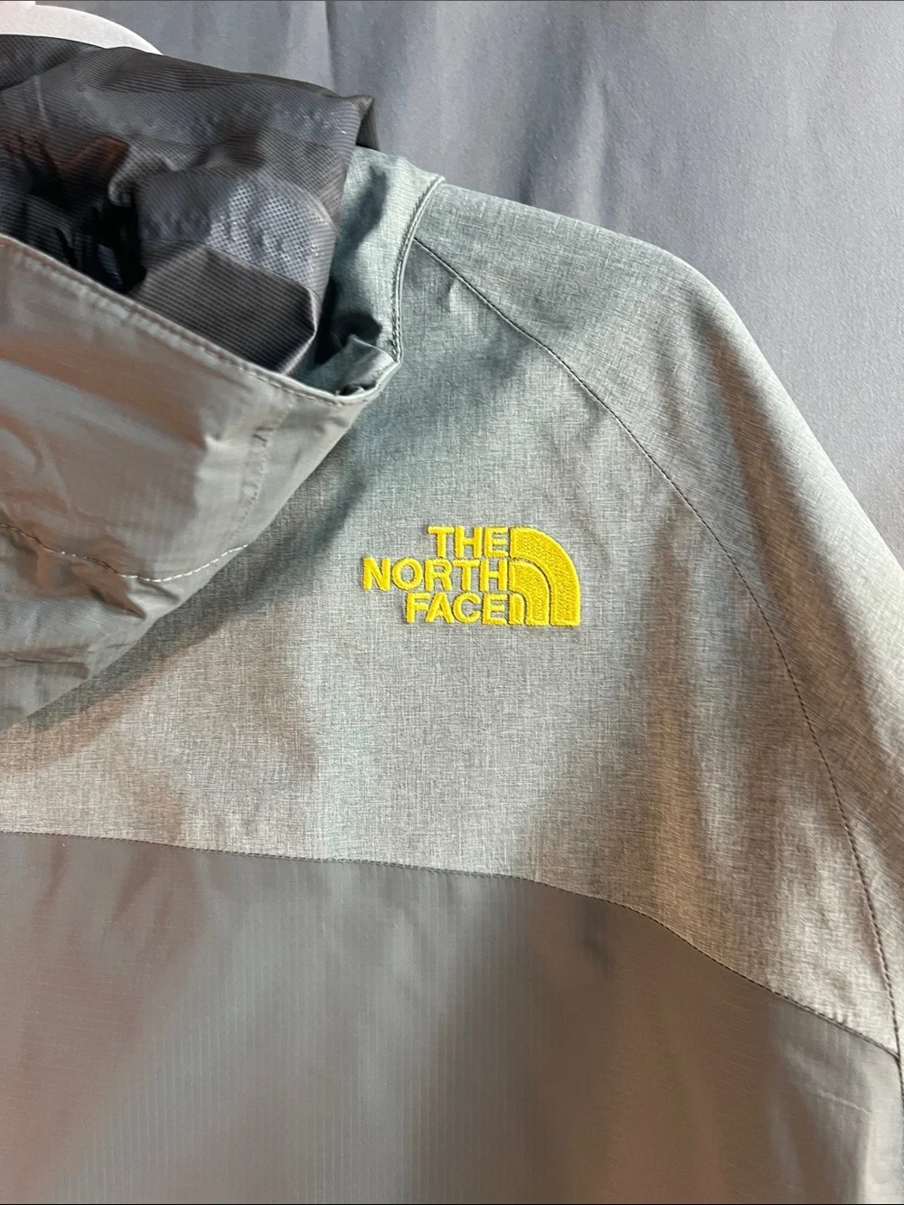 The North Face waterproof men’s XL HyVent 2.5L Shell with Yellow Logo